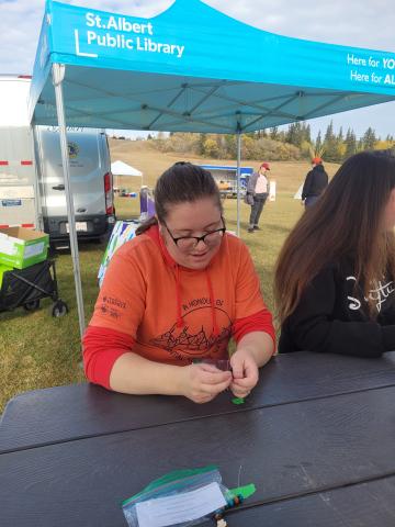 SAPL's Emily Baxter beading with the community